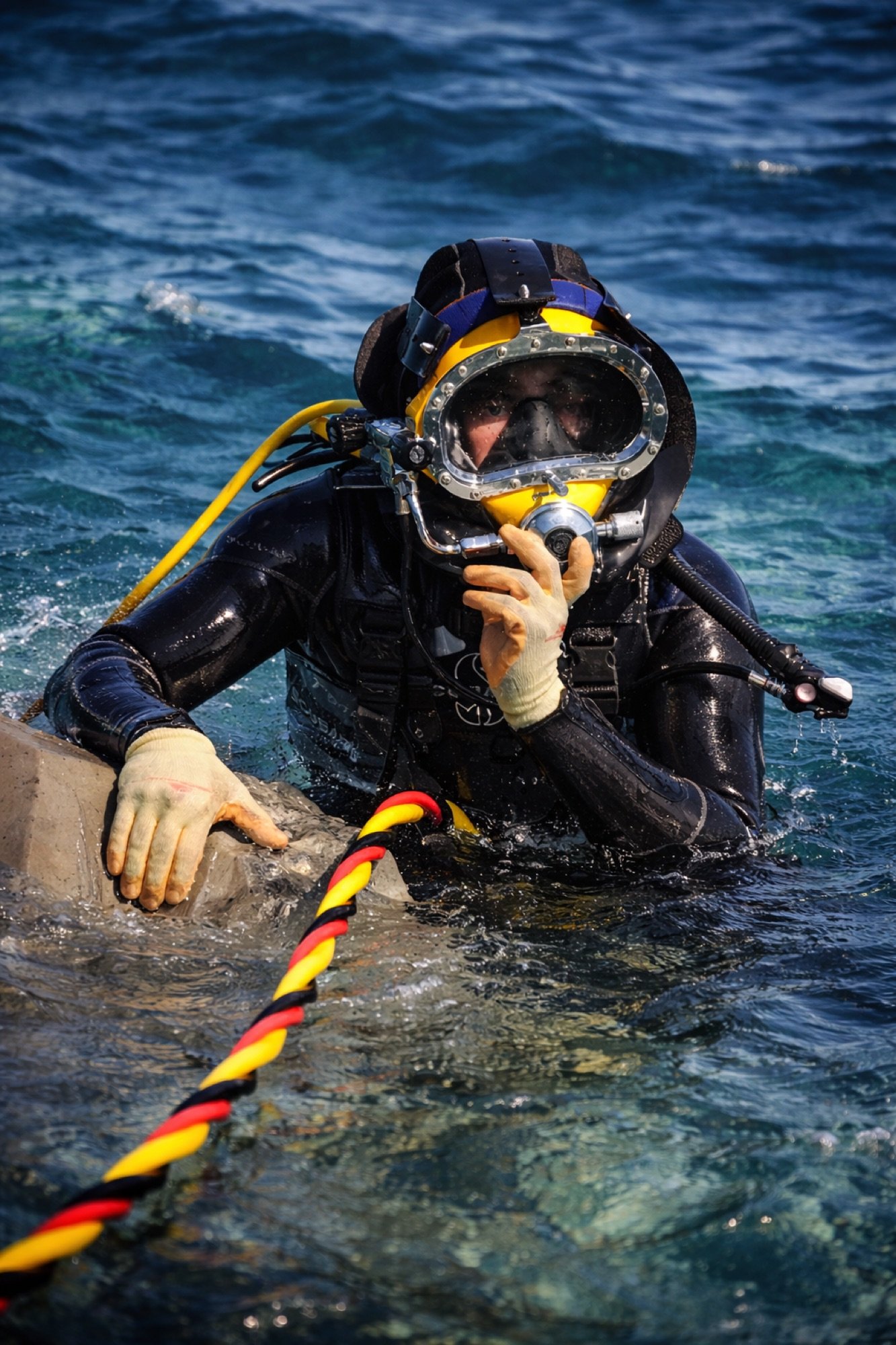 Commercial diver in helmet during subsea construction operation